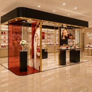 Glass Beauty Booth | Transparent Luxury Makeup Pavilion - Sunzen 3 Front real shot gold frame transparent glass luxury cosmetic pavilion inside premium beauty boutique