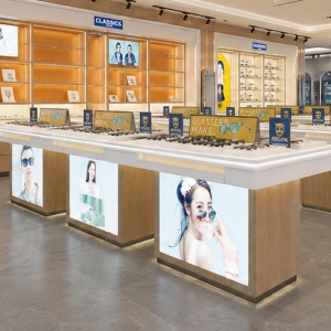 Triple Module Eyewear Island | Backlit Poster Optician Counter - Sunzen 4 Full front render shot three-module combined backlit poster eyewear island inside modern optical boutique central aisle
