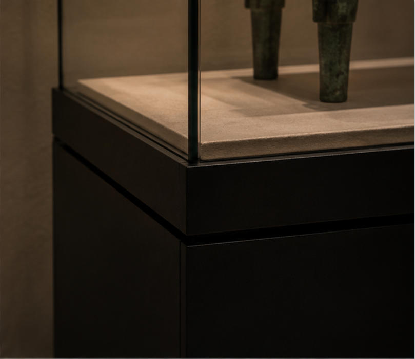 Black pedestal, glass enclosure and interior lining material details