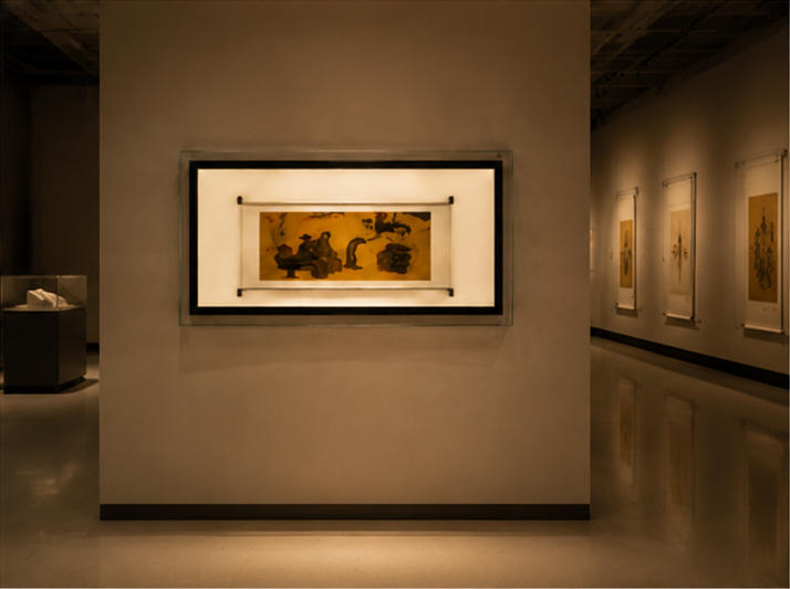 Double-framed document display case in museum setting