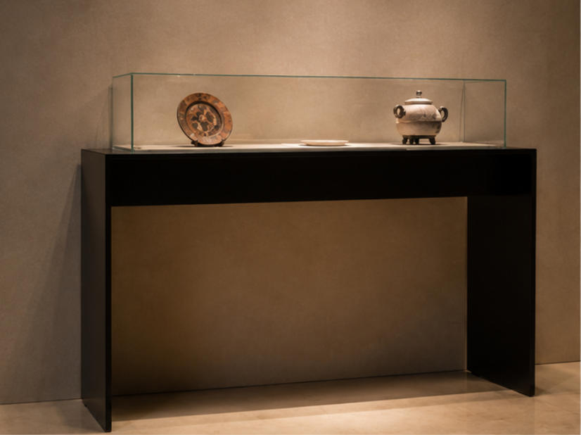 Open-frame tabletop artifact display case different angle view