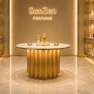 Round Marble Perfume Island | Fluted Gold Central Fragrance Table - Sunzen 3 Front real shot round marble perfume island inside luxury perfume boutique