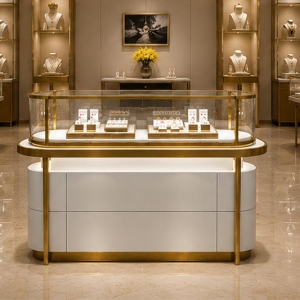 Curved Glass Jewelry Counter | Gold Frame Showcase - Sunzen 6 Curved glass jewelry counter applied in a luxury jewelry boutique