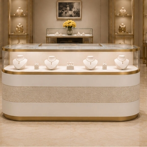 Curved Front Jewelry Showcase | Gold Trim Counter - Sunzen 3 Curved front jewelry showcase applied in a luxury jewelry boutique
