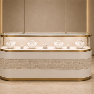 Curved Front Jewelry Showcase | Gold Trim Counter - Sunzen 2 Curved front jewelry showcase with gold trim, fabric inlay, and marble top