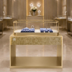 Golden Marble Jewelry Stand | Hollow Frame Rectangular Glass Display Cabinet - Sunzen 3 Hollow frame golden marble ring set display stand placed inside high-end light luxury jewelry boutique