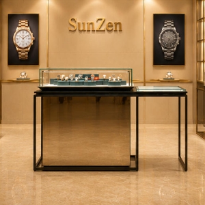 Real shot matte gold island cabinet inside high-end watch boutique center