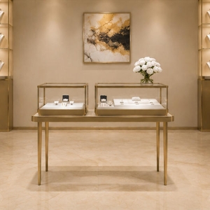 Double Tabletop Jewelry Case | Paired Gold Display Cabinet - Sunzen 4 Two-unit paired jewelry display set arranged inside minimalist jewelry boutique