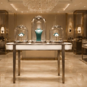Dome Glass Jewelry Table | Rose Gold Thin Leg Oval Top Display Counter - Sunzen 3 Three dome oval jewelry table placed inside light luxury jewelry boutique window