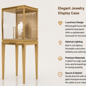 Close-up hollow geometric gold pattern backboard, top long strip anti-glare LED light, matching white necklace bust inside pattern gold back pedestal four leg tower vitrine