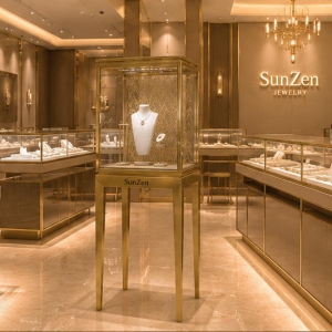 On-site render pattern gold back pedestal branded tall gem stand arranged as window focal landmark inside light luxury jewelry boutique