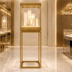 Jewelry Full Gold Cube Pedestal Display Tower | Light Metal Vertical Showcase – Sunzen 6 Real Installation Shot In Minimalist Light Luxury Fine Jewelry Boutique Storefront Window & Entrance Corner Landmark Focal Zone