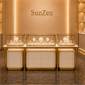 Gold Jewelry Glass Counter | Luxury Retail Display Kiosk - Sunzen 3 Full front render shot three-piece nested modular gold trim glass jewelry island inside minimalist luxury jewelry boutique