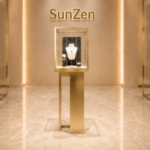Tall Gold Vitrine | Floor Jewel Tower Necklace Display Stand - Sunzen 3 Full vertical render standalone floor jewel tower lockable tall gold vitrine with built-in necklace display stand for boutique window focal jewelry showcase
