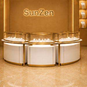 Curved Modular Jewelry Island | Gold Trim Glass Counter Central Jewelry Kiosk – Sunzen Display 3 Front real shot of three-unit curved modular jewelry island central jewelry kiosk inside Sunzen fine jewelry retail boutique