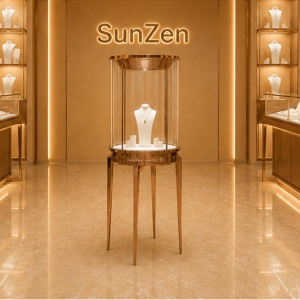 Round Glass Jewelry Tower | Rose Gold Pedestal Stand Tall Circular Showcase – Sunzen Display 3 Front real shot of round glass jewelry tower central jewelry plinth inside Sunzen luxury jewelry boutique