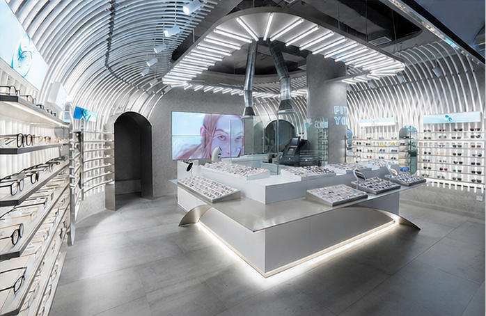 Full interior render shot curved ceiling optical store wave central optician island modern minimalist eyewear boutique