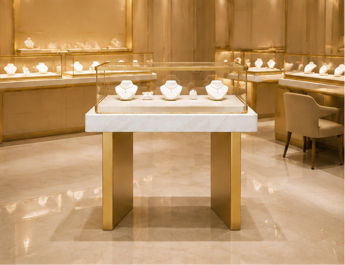 Two-plinth marble band jewelry showcase placed inside light luxury fine jewelry boutique