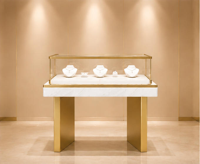Marble band front jewelry table with two flat gold plinth legs and top rectangular glass cabinet