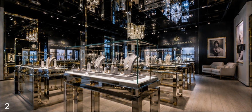 Mirror ceiling display stands under black reflective ceiling in jewelry boutique
