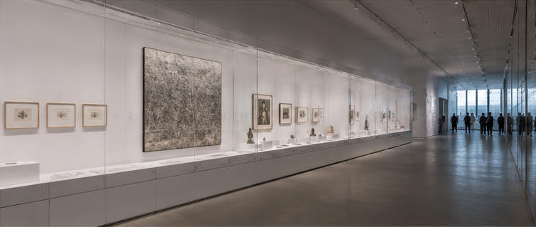 White steel showcase for long open circulation corridors